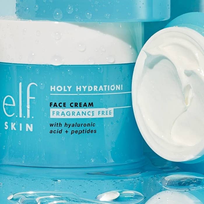 An opened jar and closed jar of face moisturizer