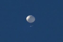The white balloon in the sky.
