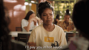 &quot;I&#x27;ll pay you in hot sauce&quot; gif from &quot;Grown-Ish&quot;