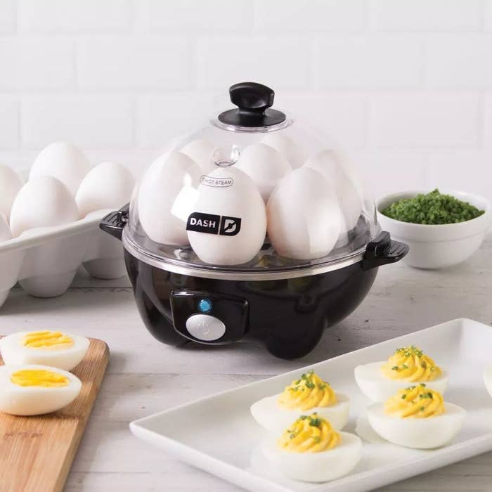 The black egg cooker cooking seven eggs at once