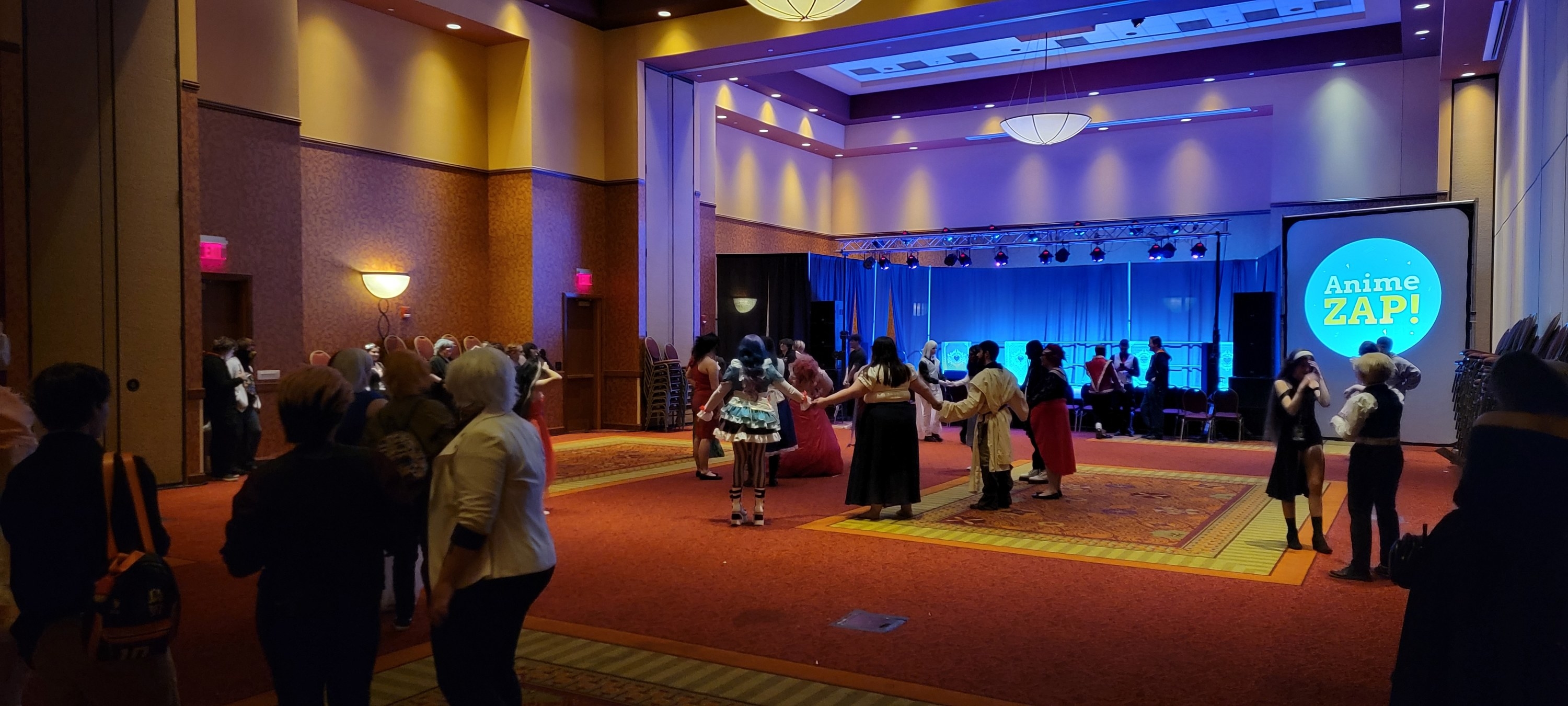 Photo of Anime ZAP showing people in cosplay dancing.