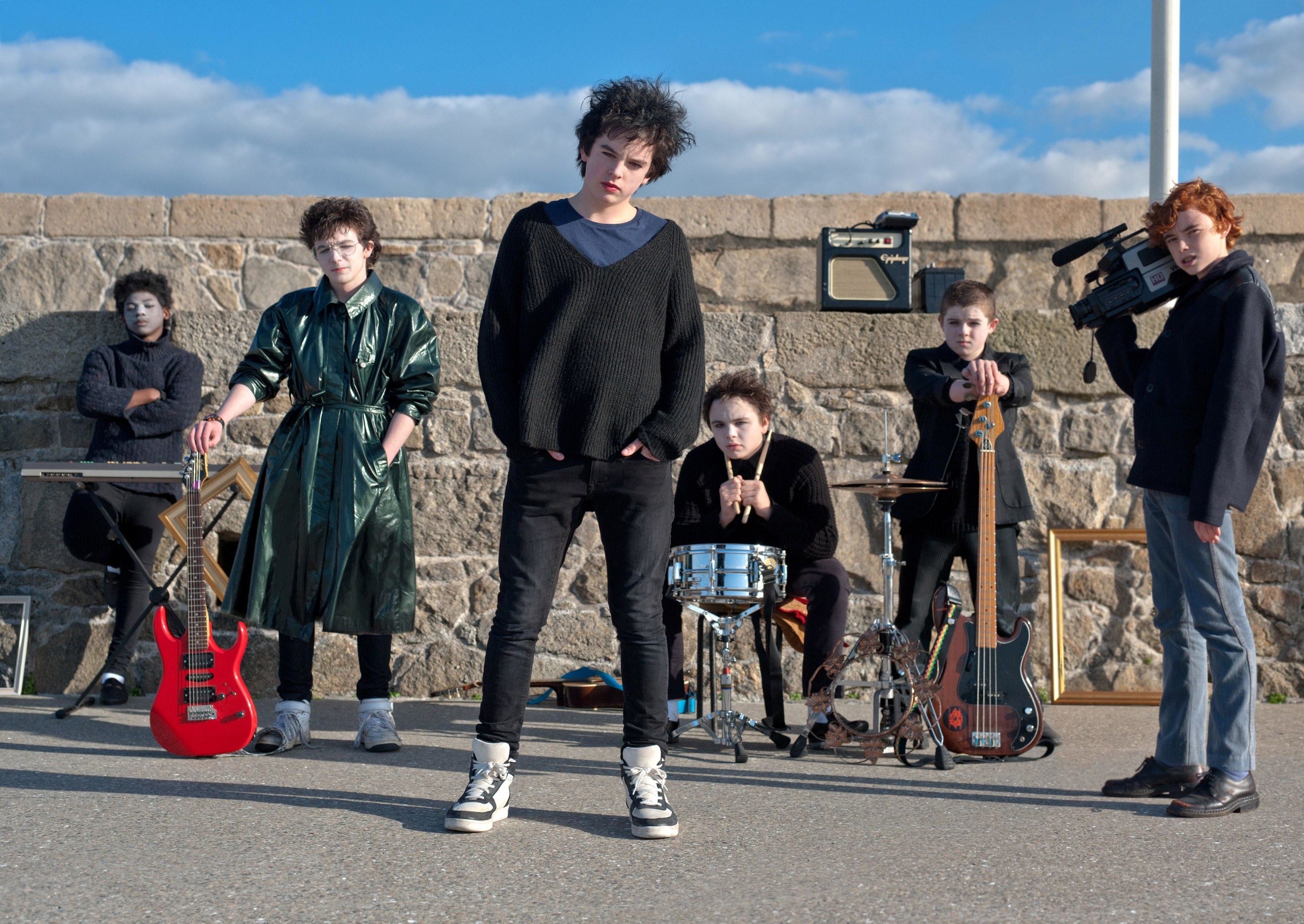 A group of teenagers pose for their band&#x27;s photo