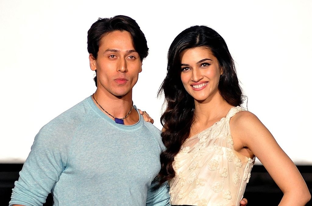 Tiger Shroff and Kriti Sanon smile and pose for a picture