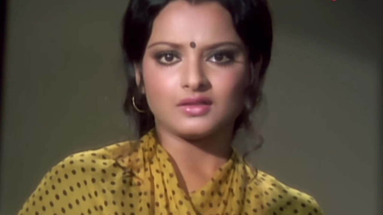 Rekha looks tensed in a still from a film