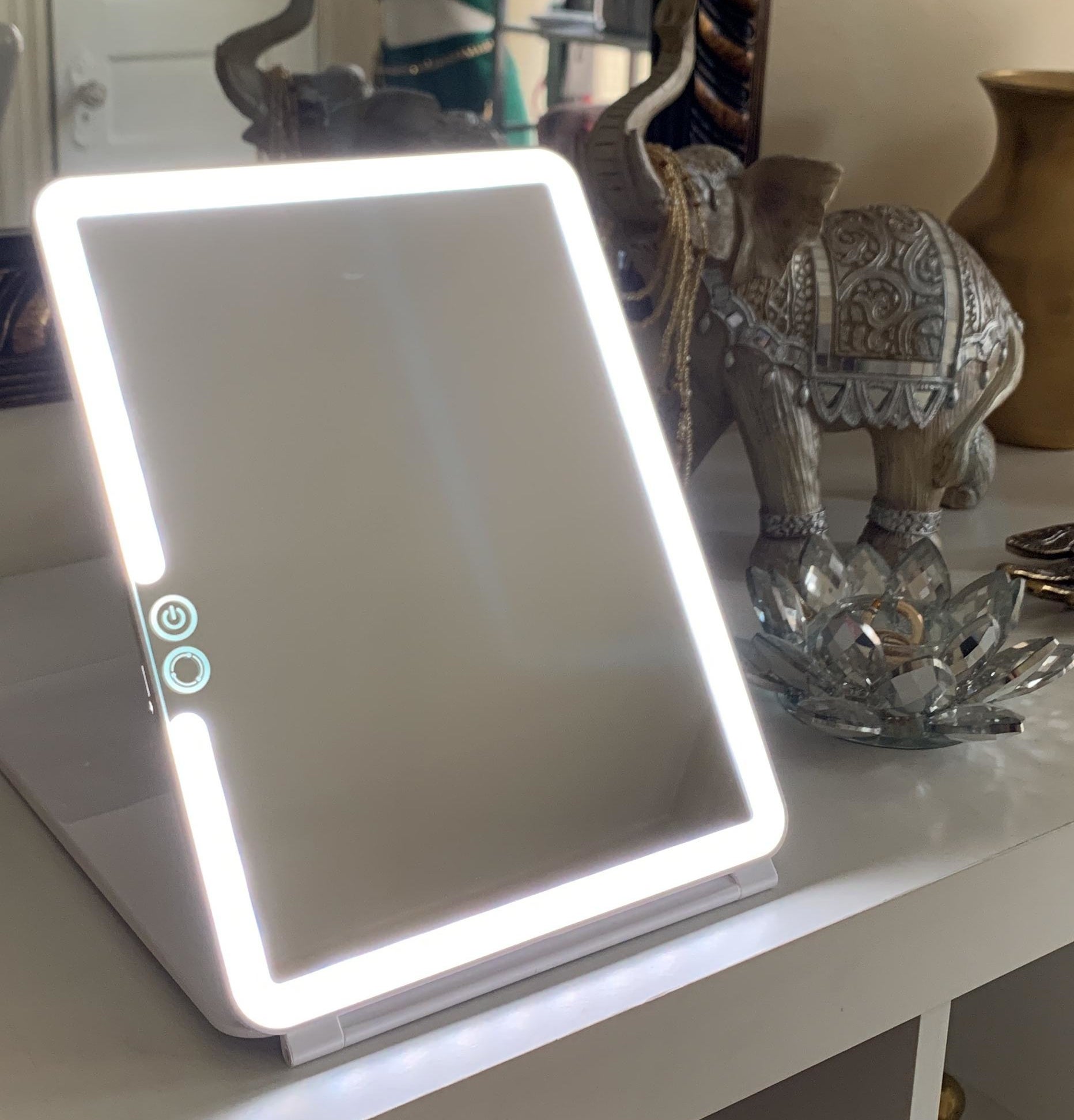 reviewer's mirror on dresser lit up