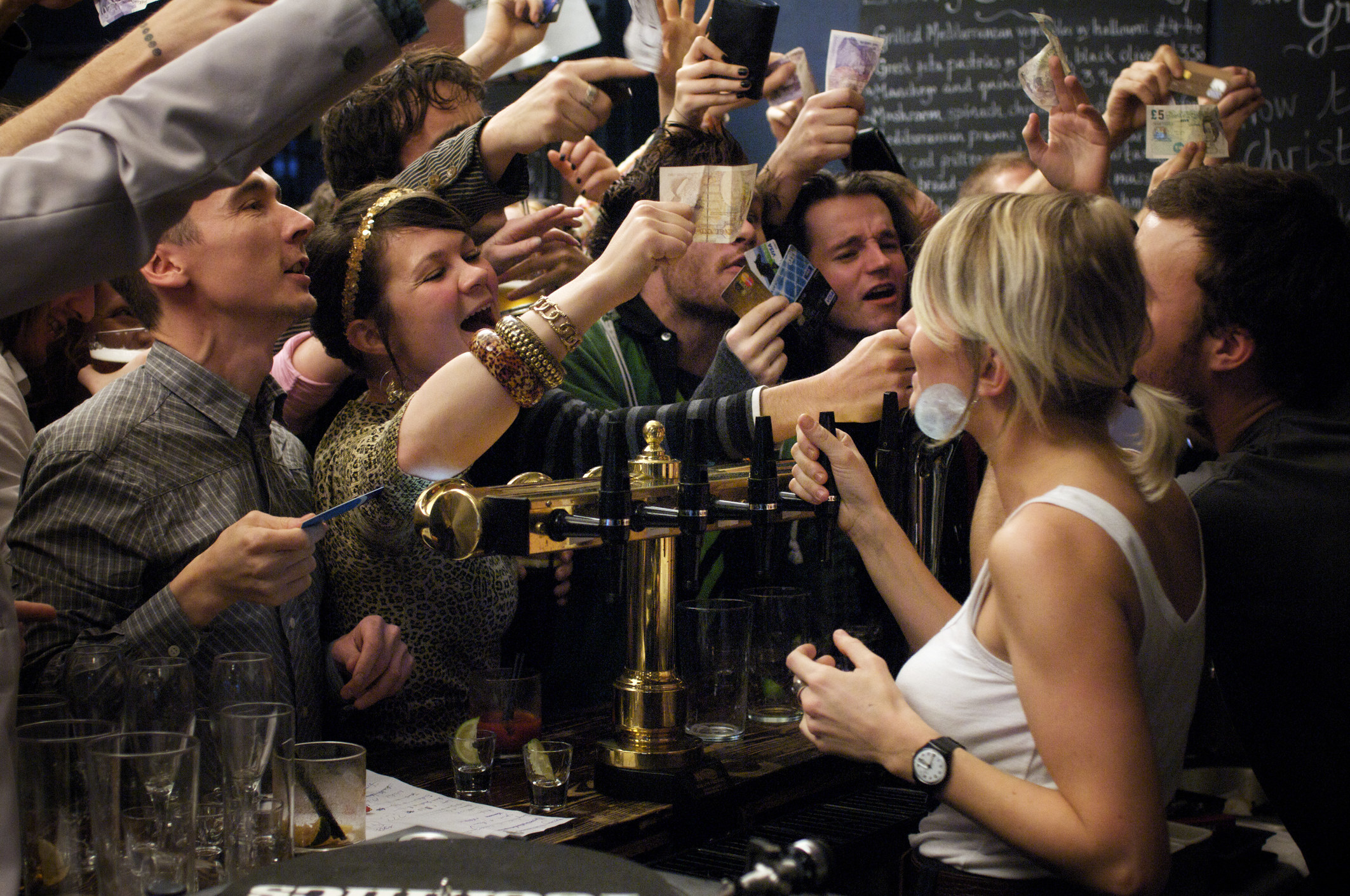 people in a pub trying to get served