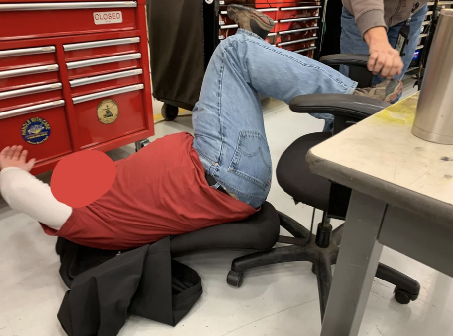 Worker falling back in chair