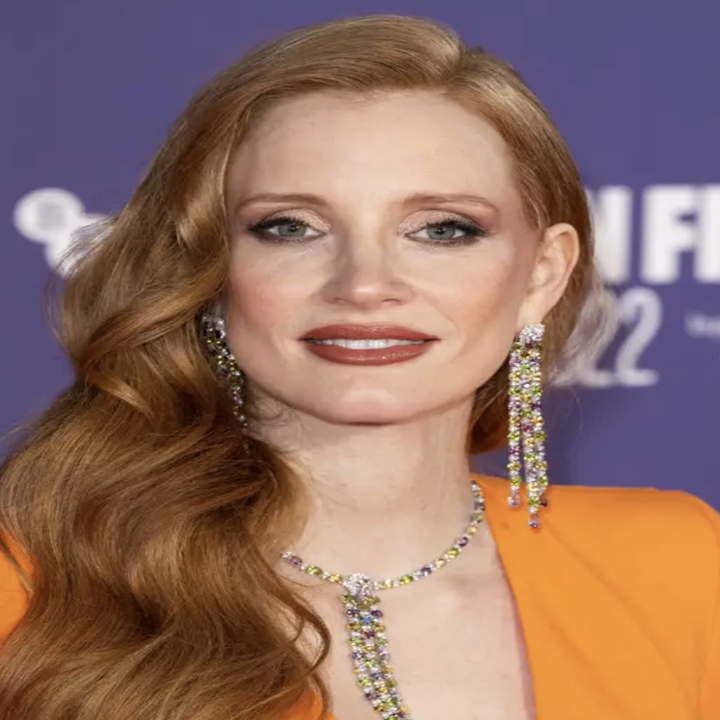 Jessica Chastain in an orange outfit on the red carpet