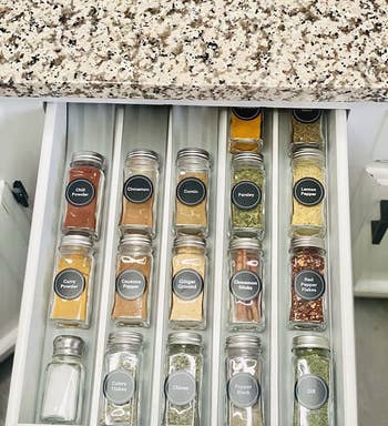 reviewer's spice jars organized on the gray liner