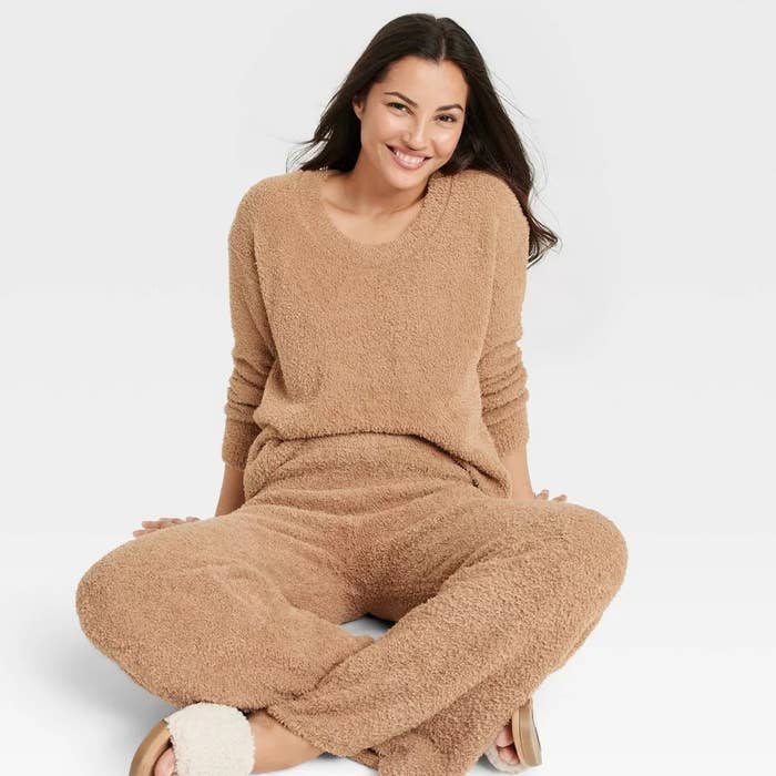 A model wearing the fuzzy sweater and pants set