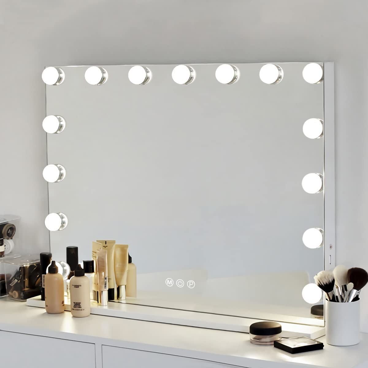 the lit up mirror on a vanity