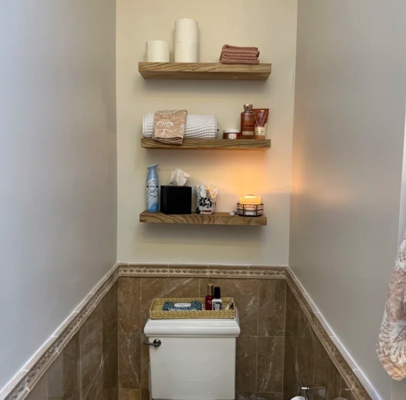 Reviewer&#x27;s photo of the shelves used in a half-bath