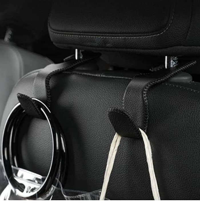 two hooks on the back of a car seat&#x27;s head rest