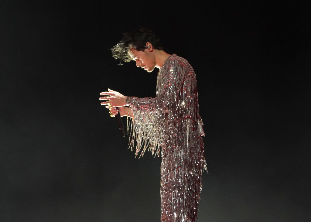 Harry performing in his glittery outfit