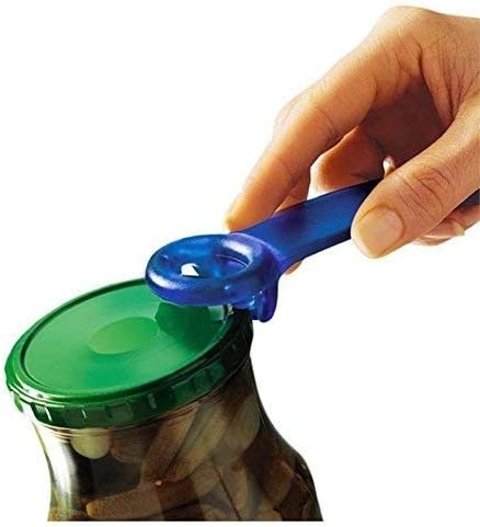 person lifting the lid with the opener