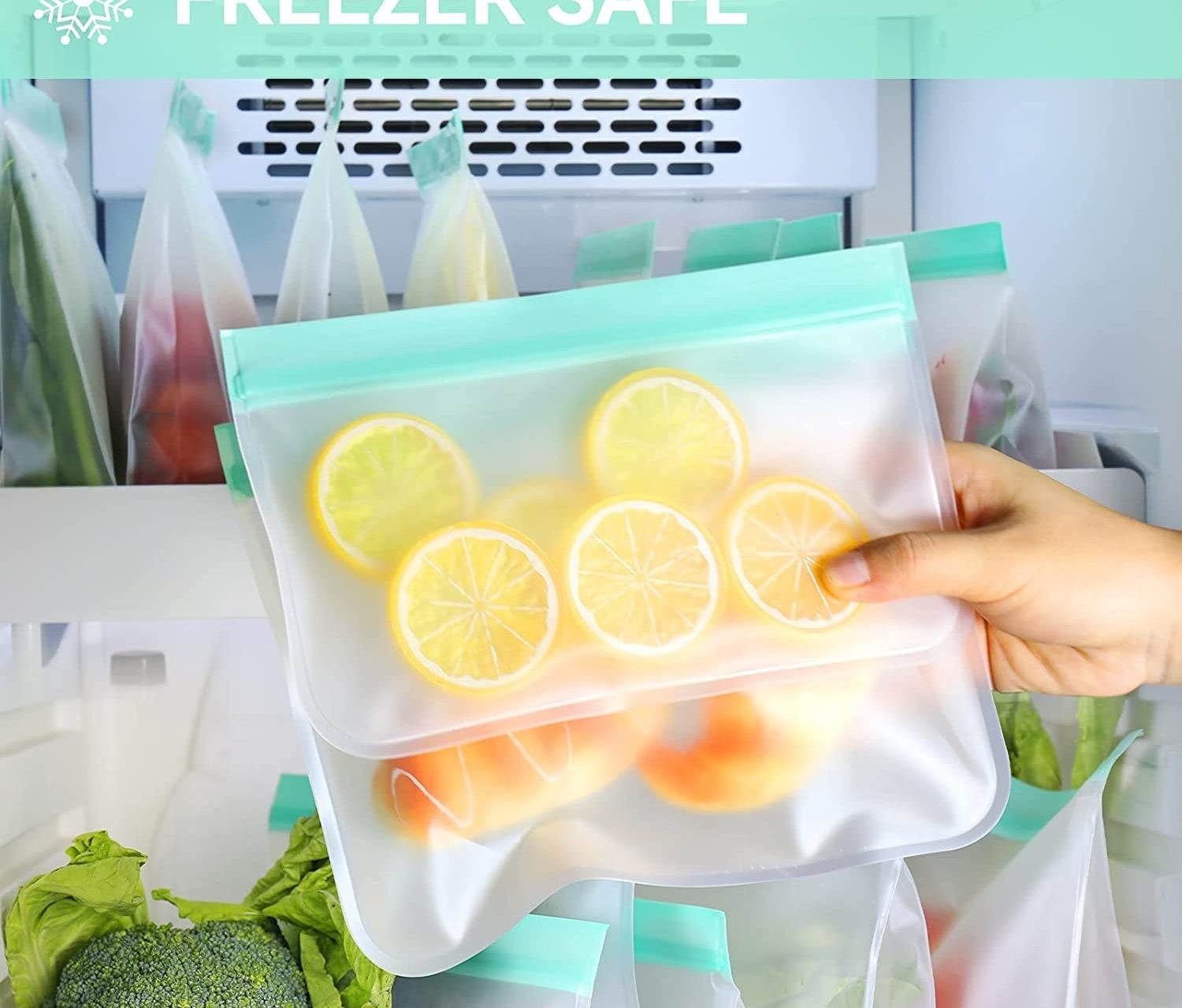 person holding the bags with lemon and other ingredients in it in front of a freezer