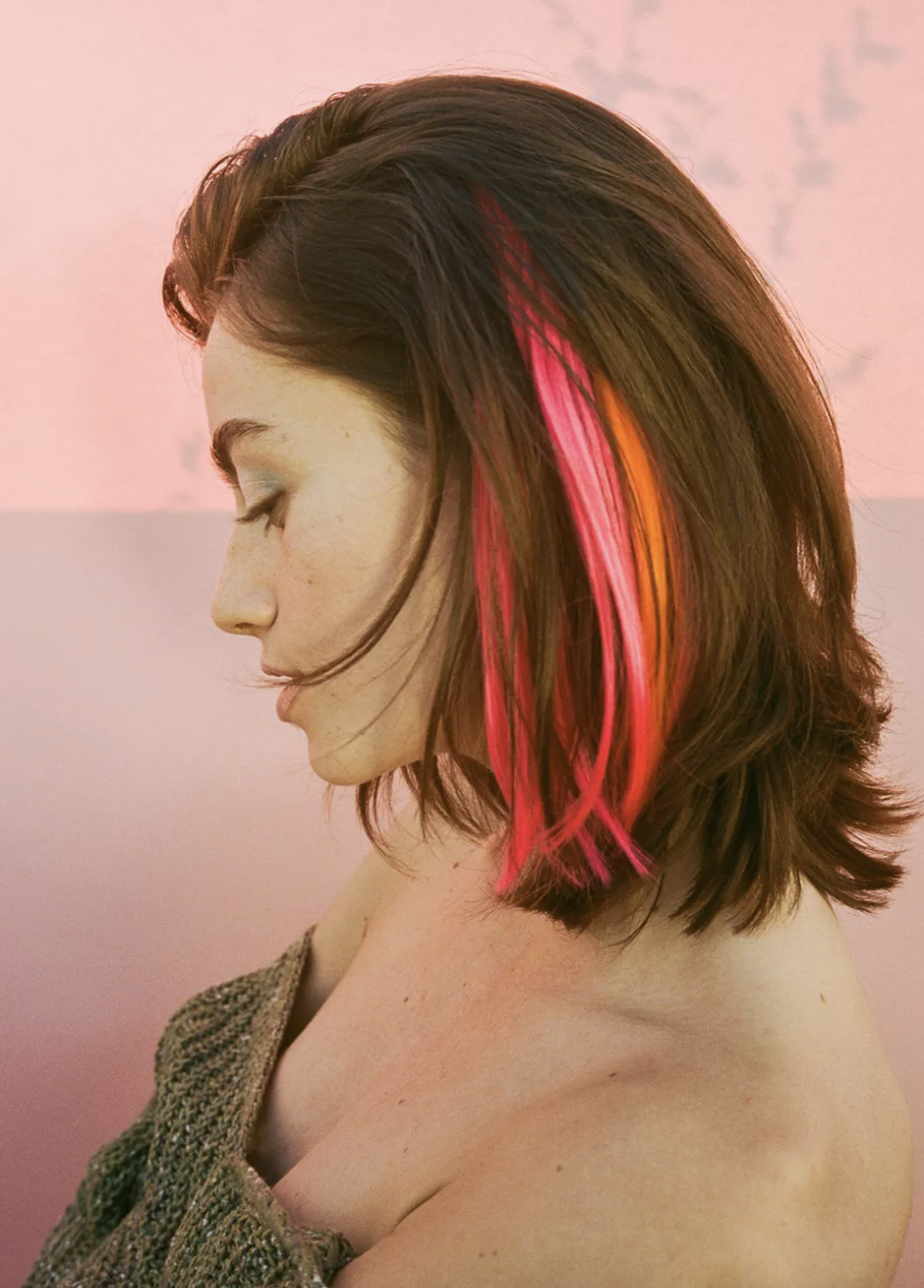 a person with the colourful hair extension clipped into their bob