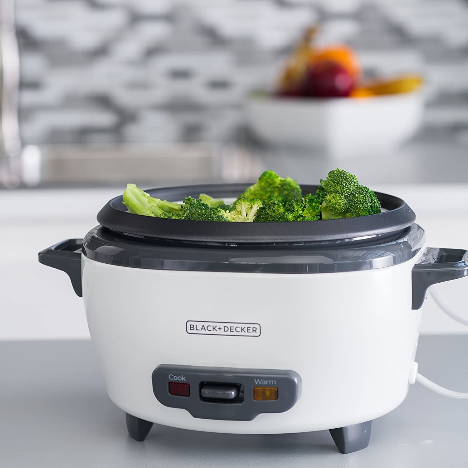 the rice cooker with broccoli in it