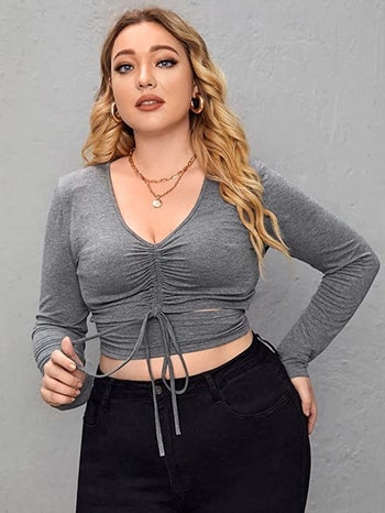 model wearing the grey top