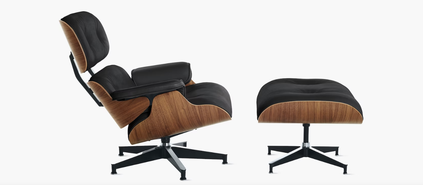 The Eames chair tilted back along with its ottoman