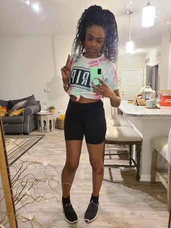 another reviewer wearing the black short