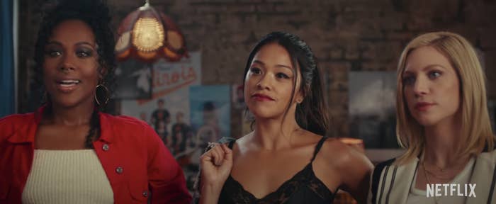 DeWanda Wise, Gina Rodriguez, Brittany Snow standing in front of a mirror