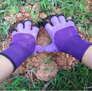 Model using gloves with claws to garden