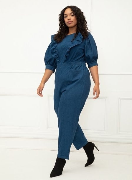 A model wearing denim jumpsuit with black boots