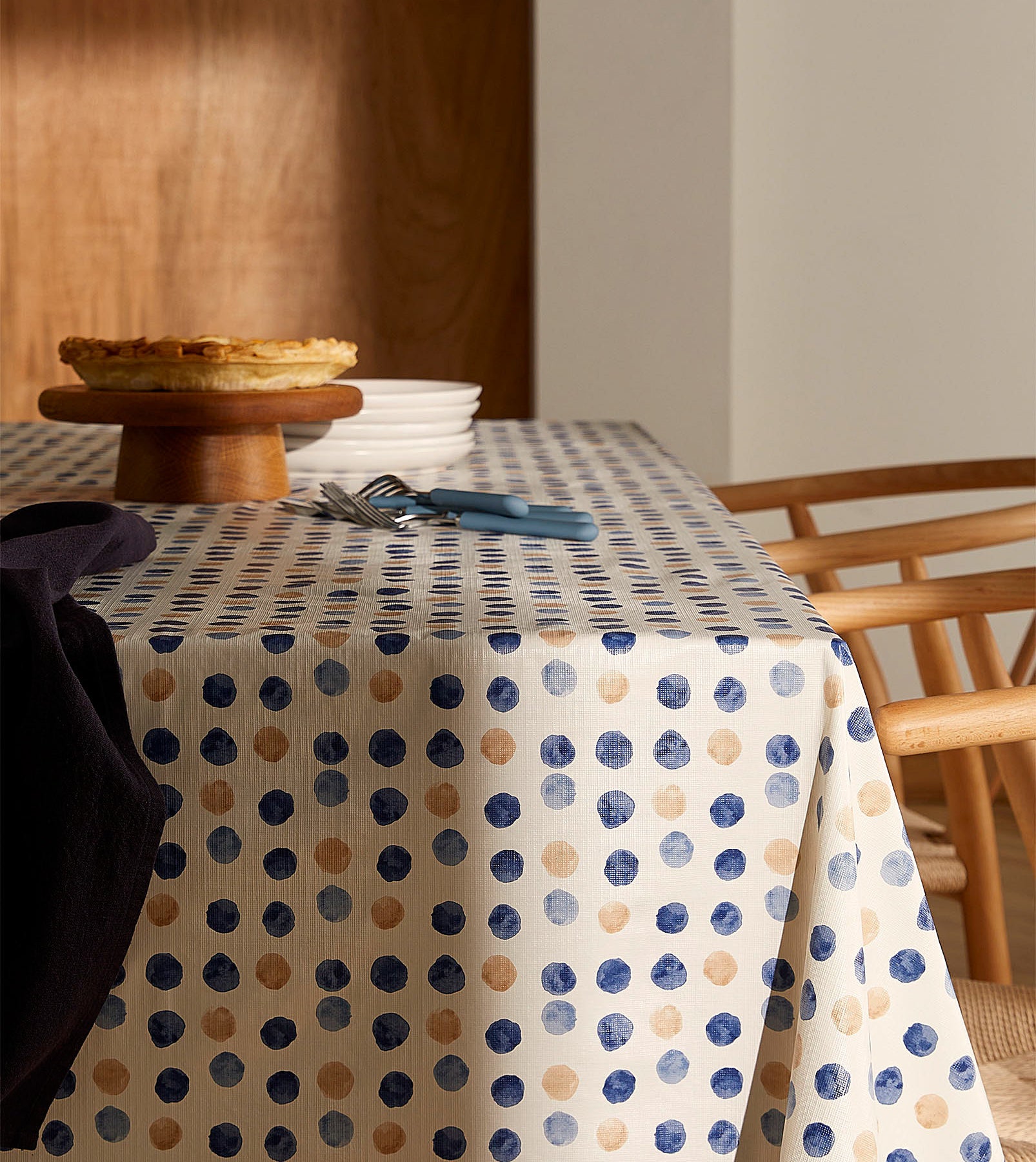 a tablecloth with watercolour-like spots all over it
