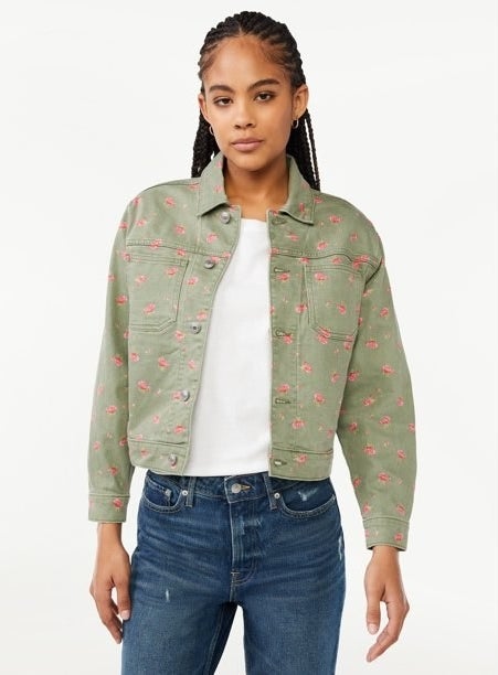 Model wearing a green and pink denim jacket