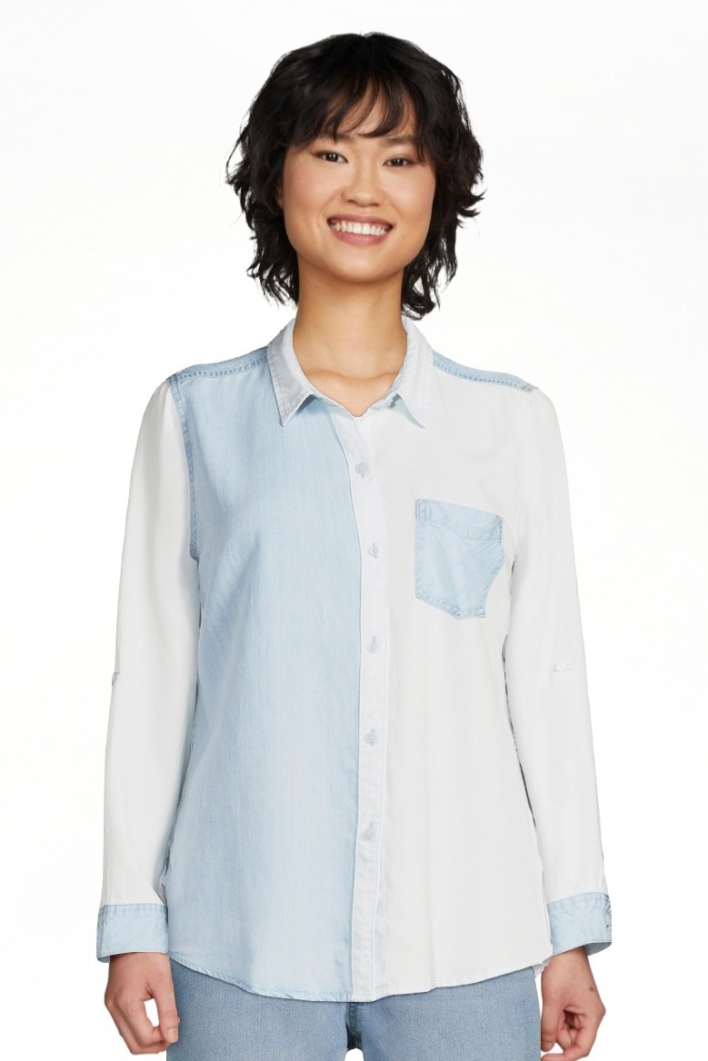 Model wearing blue and white shirt with jeans
