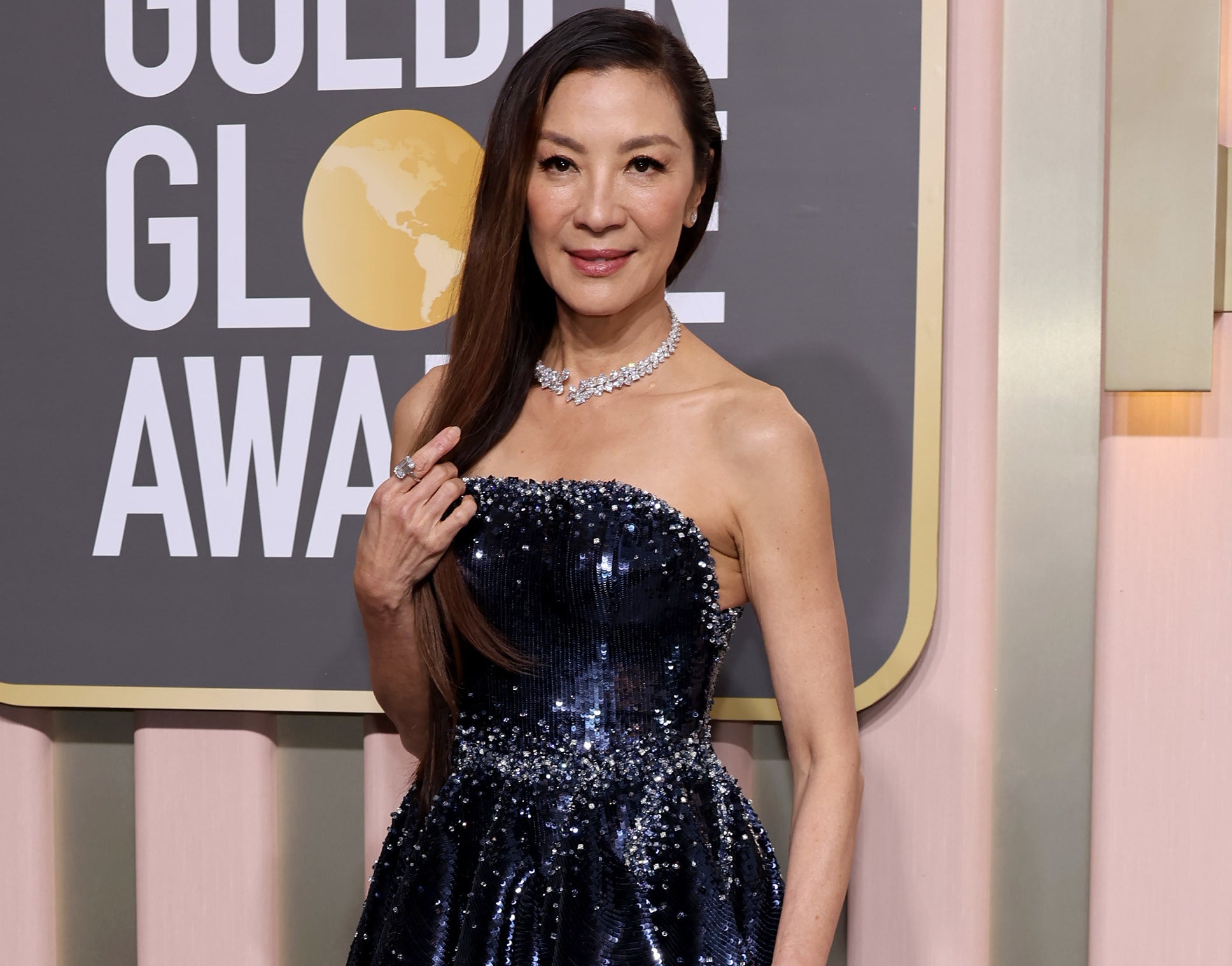 A close-up of Michelle in a strapless, sparkly dress