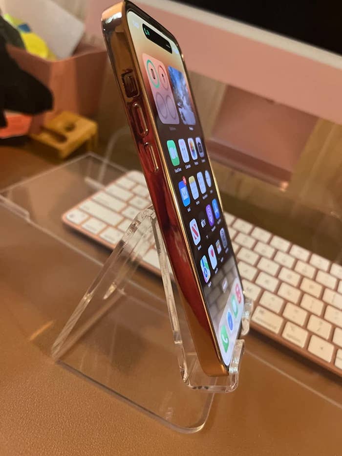 Reviewer image of their phone in the acrylic stand