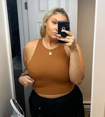 reviewer wearing the brown cropped tank