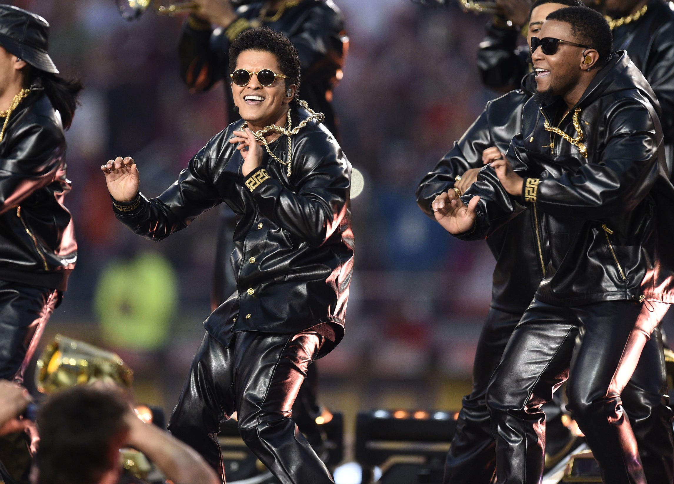 Bruno Mars, center, performs during halftime of Super Bowl 50