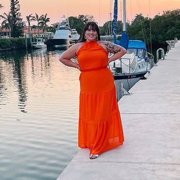 reviewer wearing the orange maxi