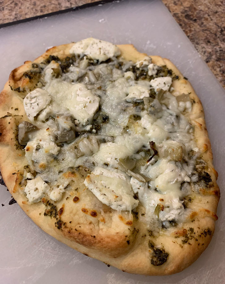 Naan flatbread with melted Brie cheese