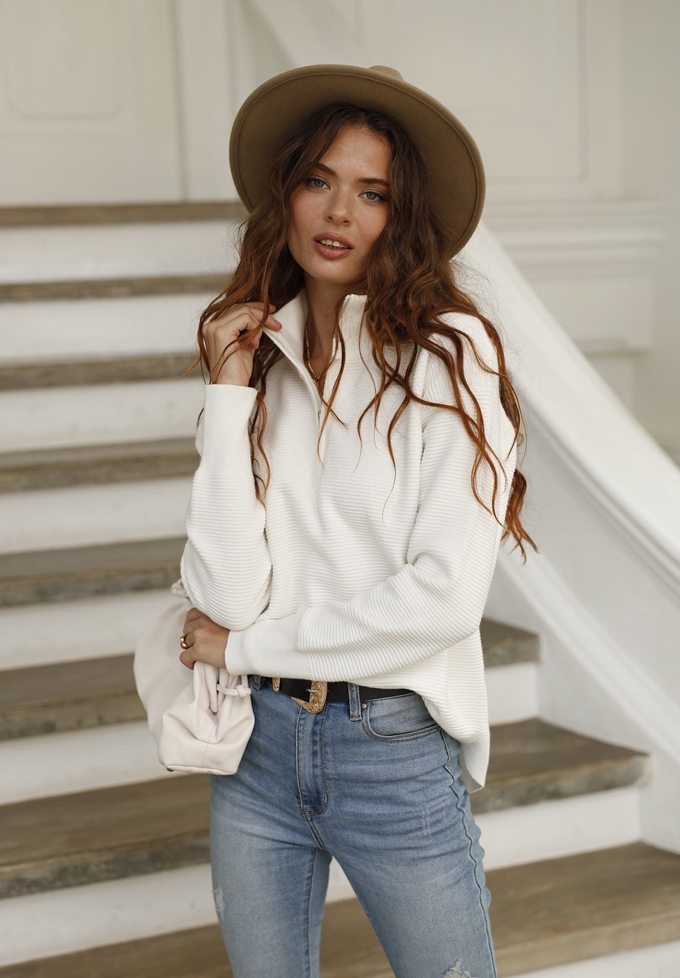 Image of model wearing white sweater