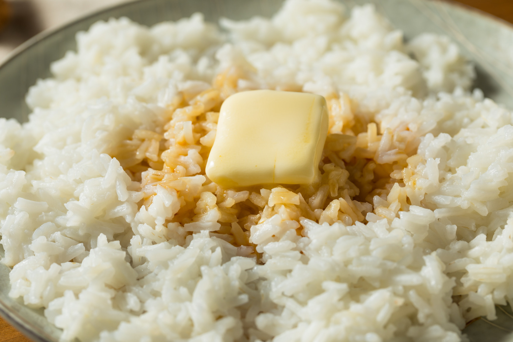 A bowl of rice with butter and soy sauce