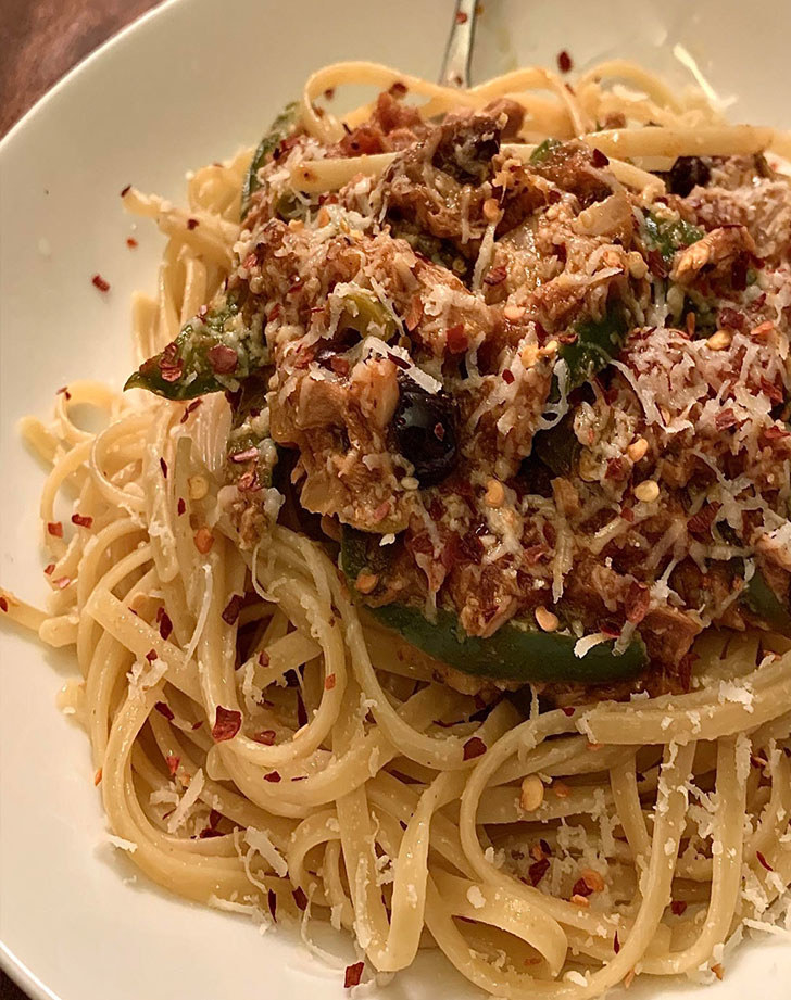 Pasta topped with tuna fish and red pepper flakes