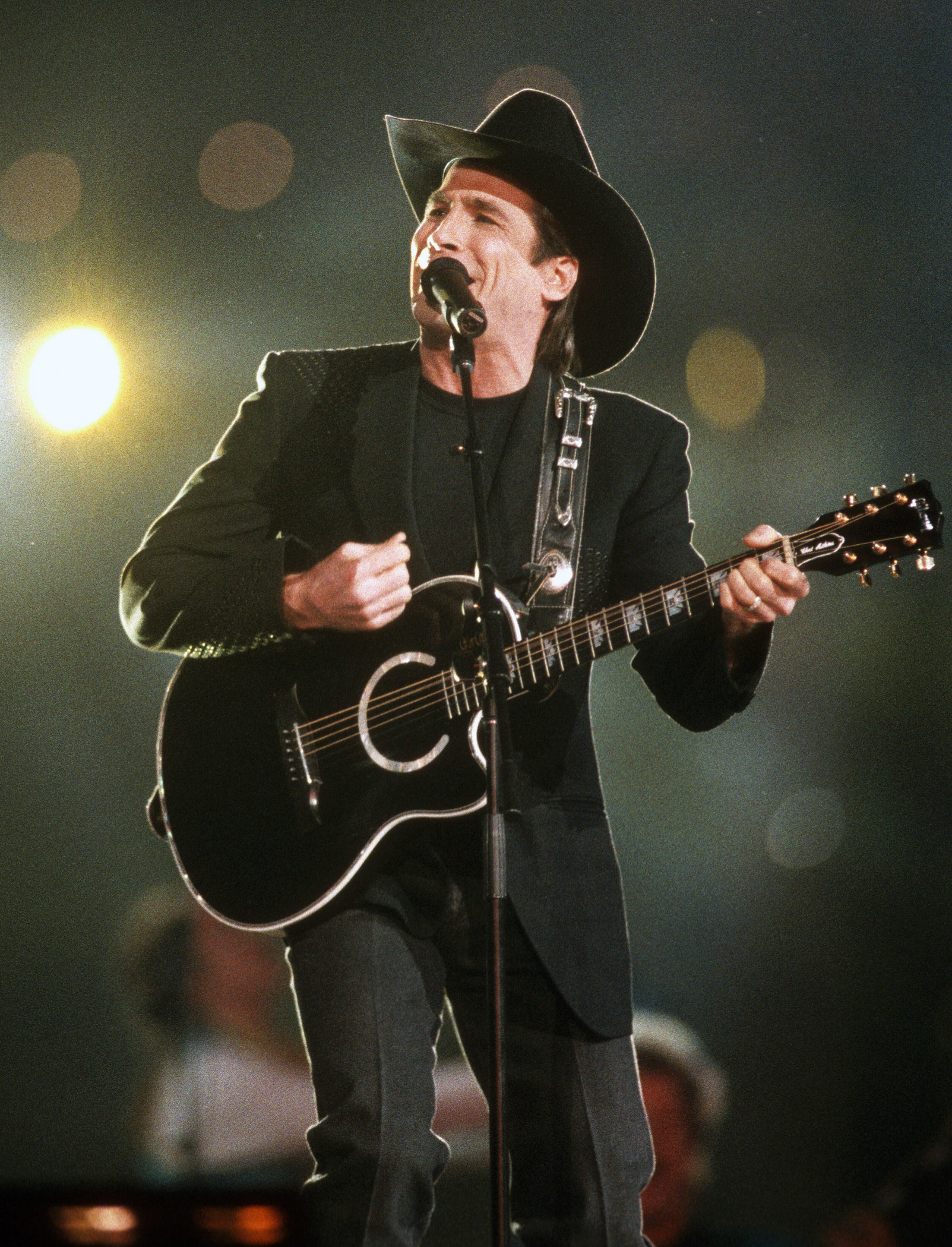 Clint Black preforms during the halftime show of Super Bowl XXVIII