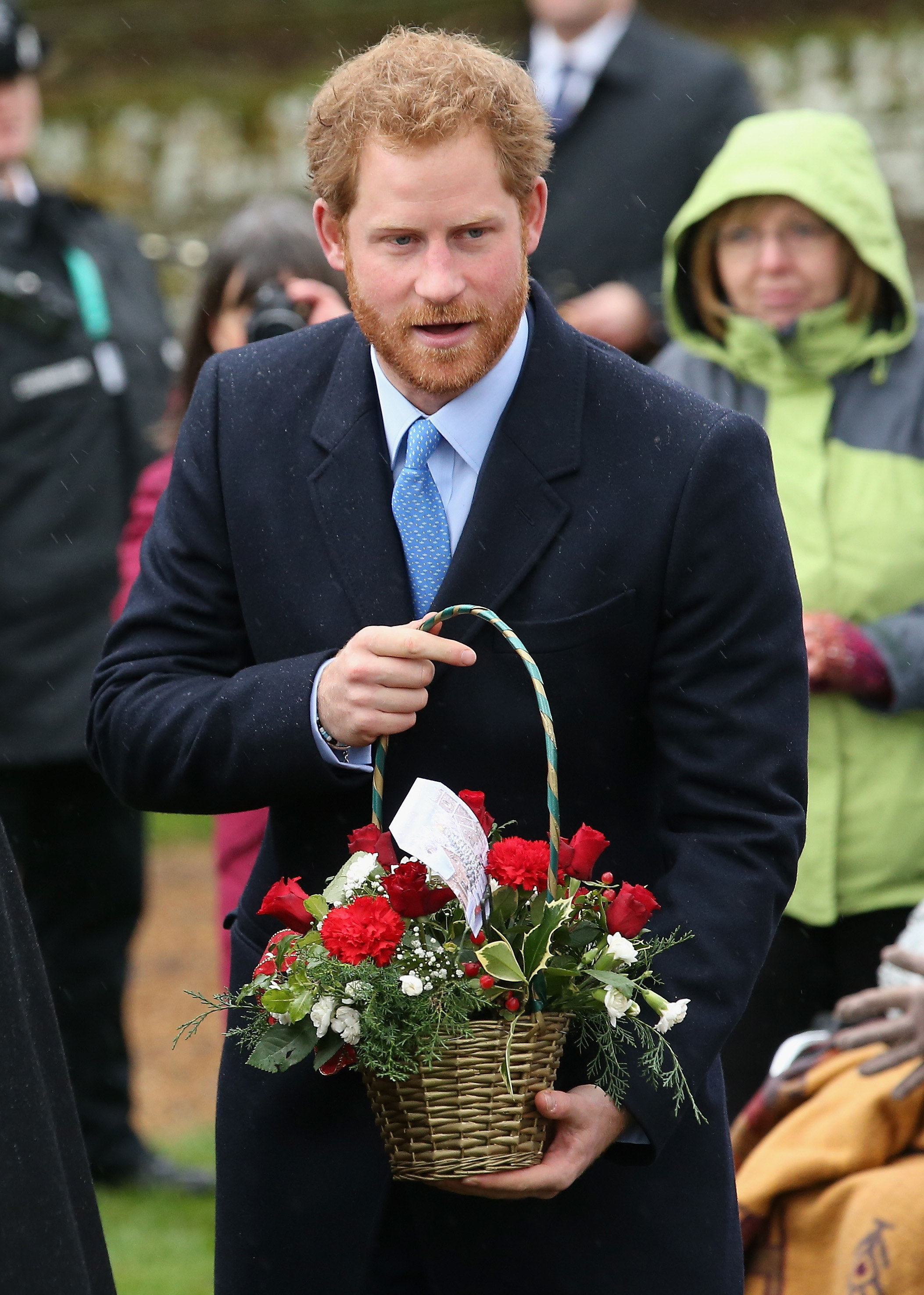 Prince Harry holding flowers