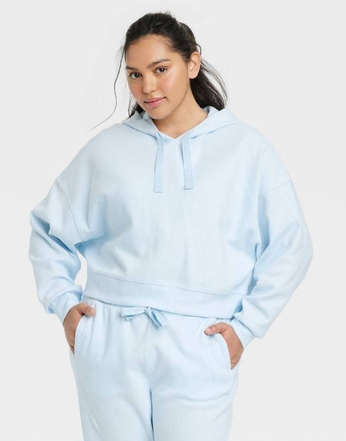 model wearing light blue ribbed hoodie