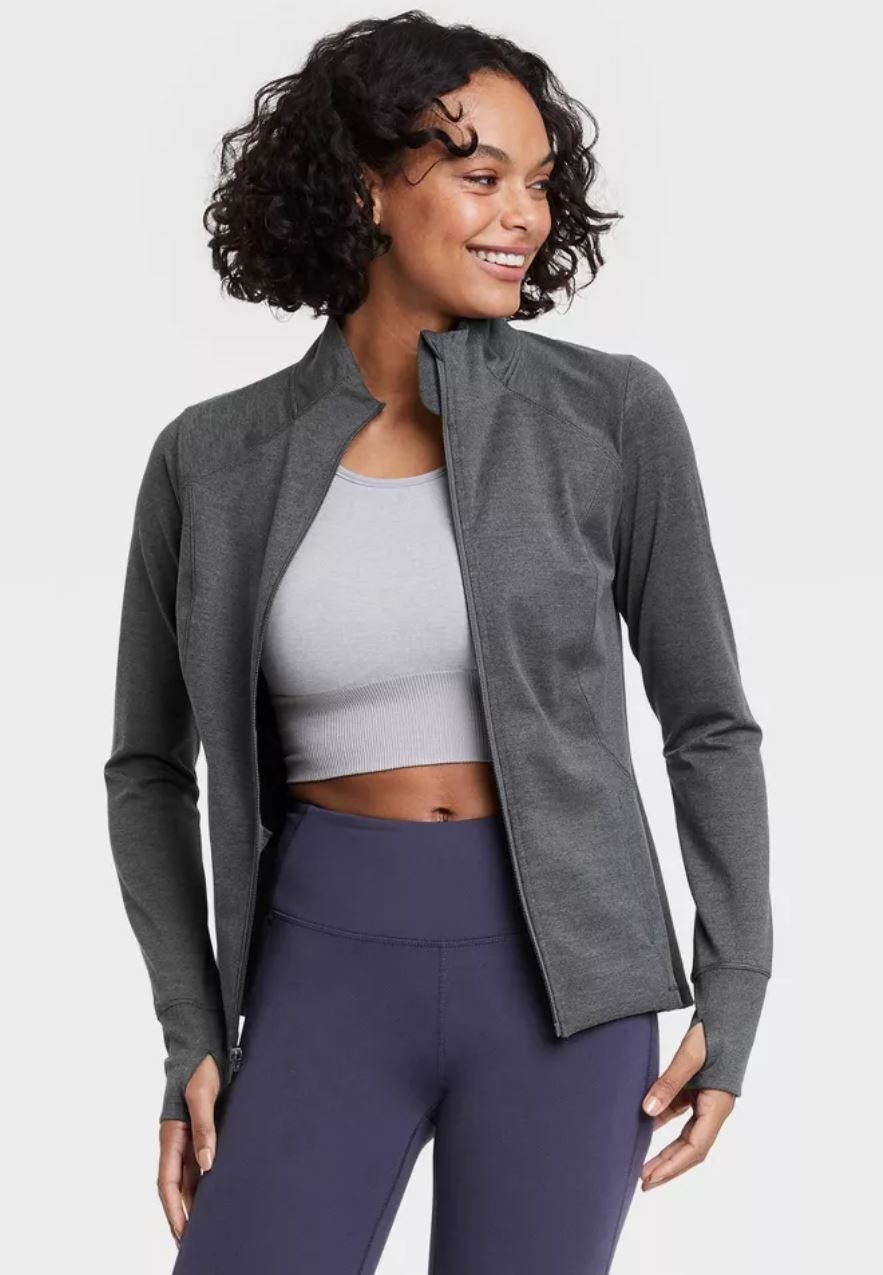 model wearing grey zip up jacket
