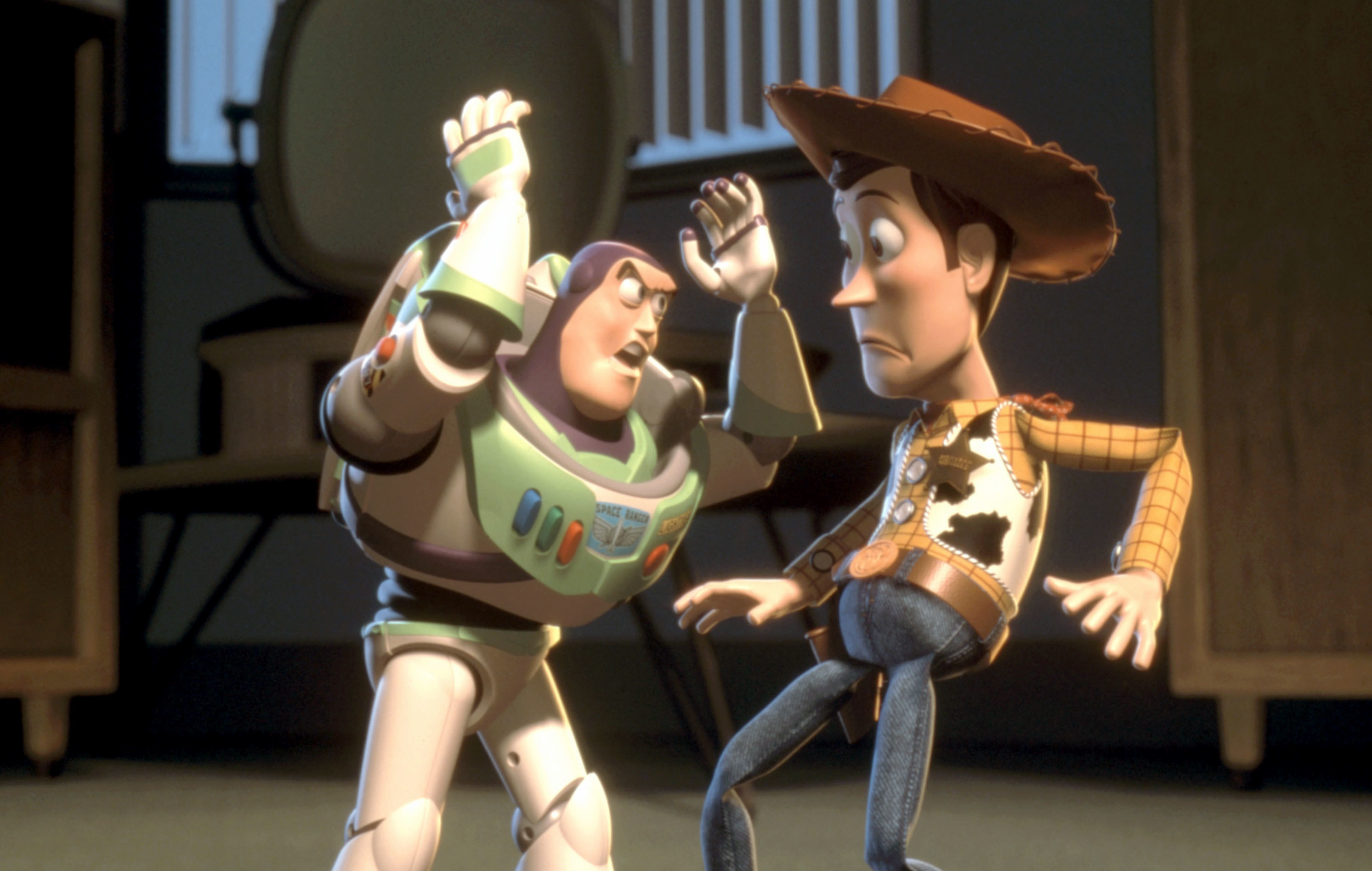 An astronaut toy argues with a cowboy toy