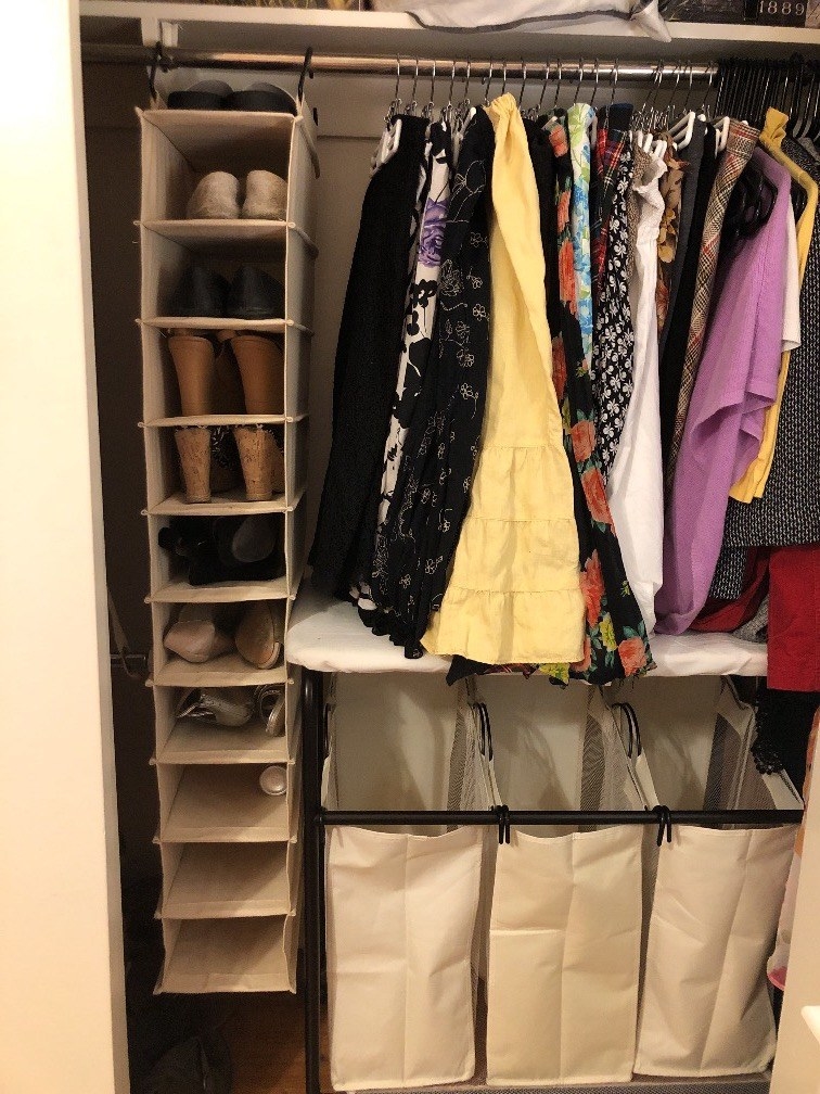 the 10-shelf organizer hanging in a closet holding shoes