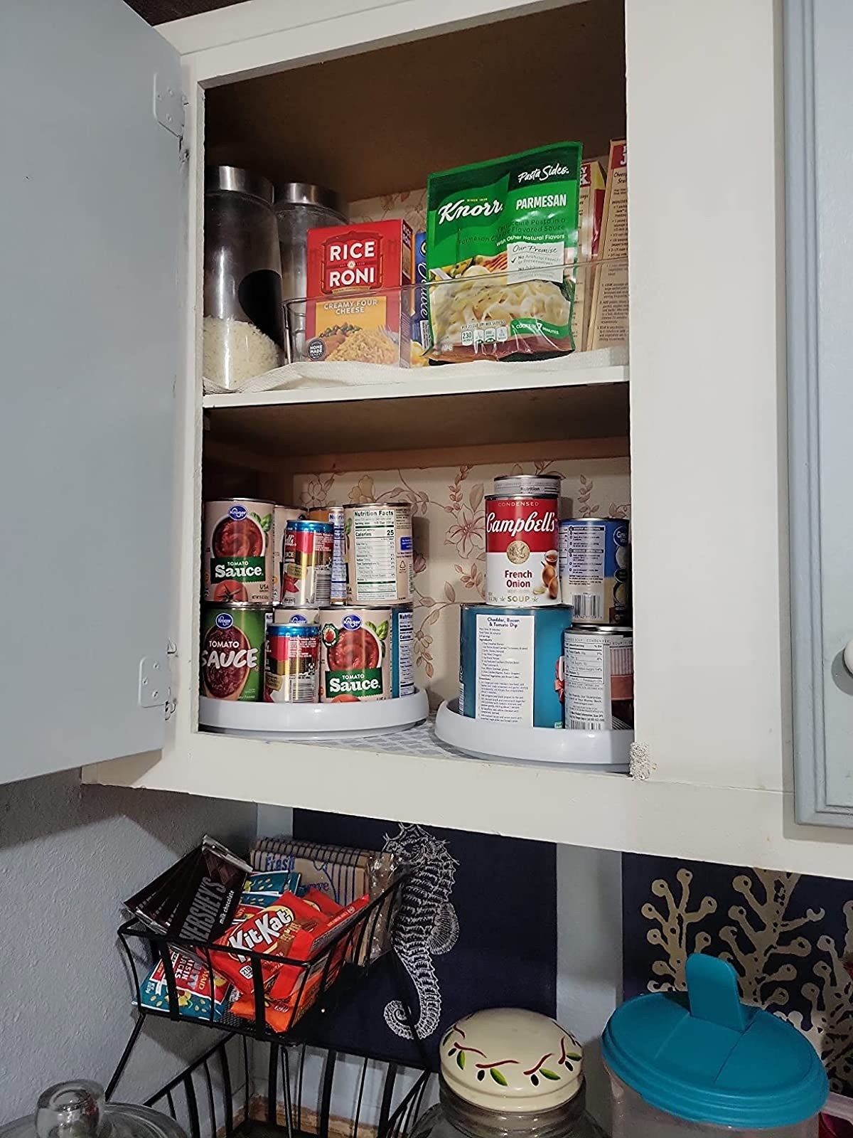 the lazy susans on a shelf inside a cabinet
