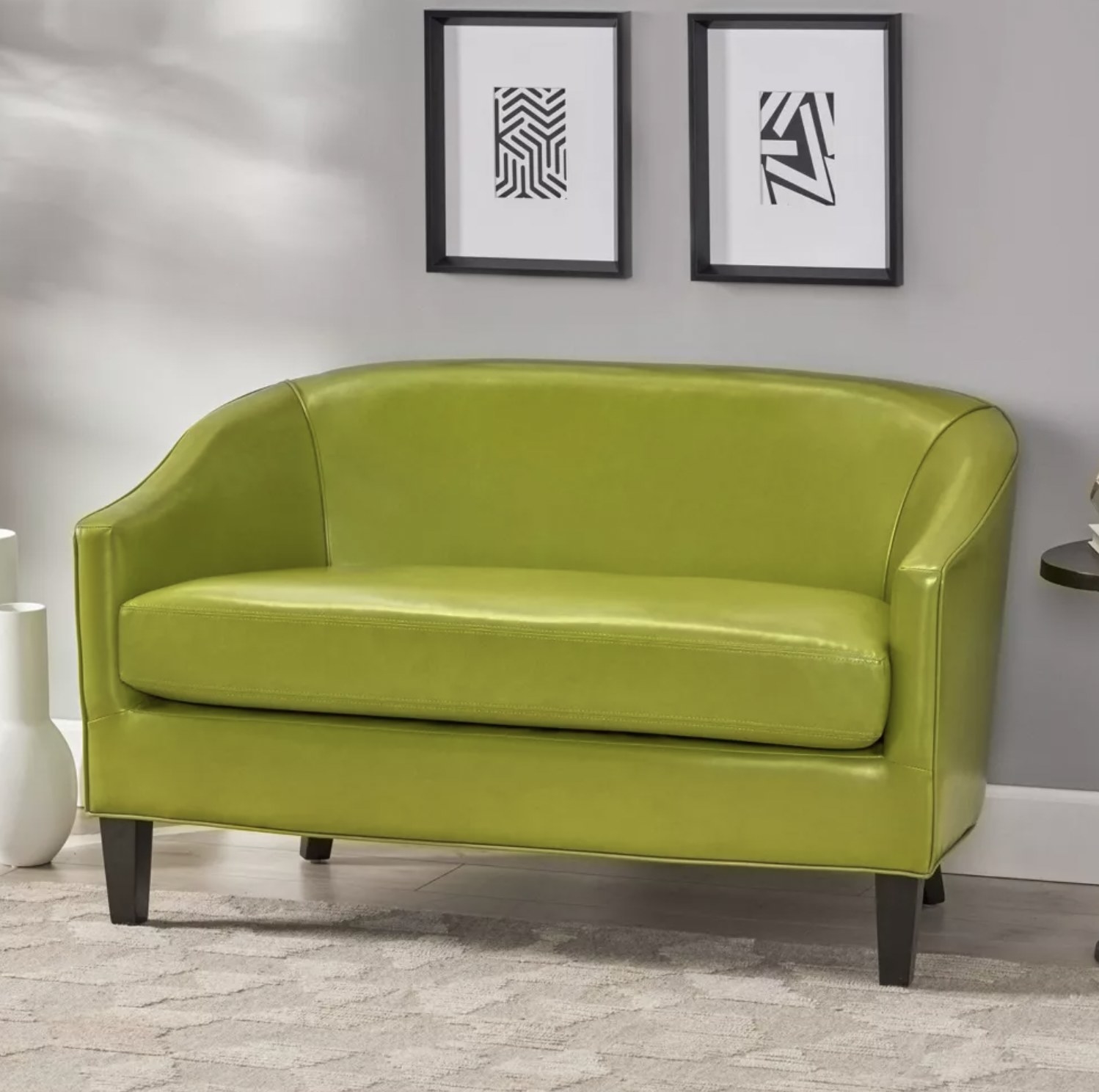 The green faux leather loveseat