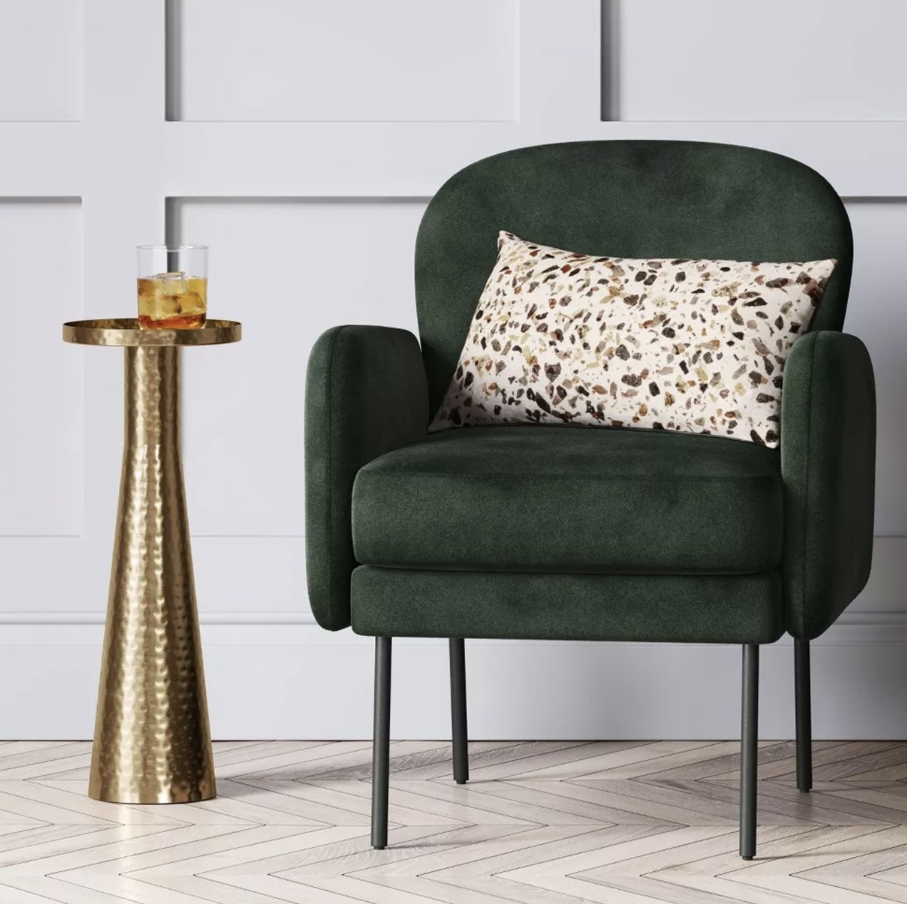 the gold side table with cocktail next to accent chair