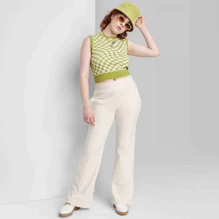 A model wearing the white french terry pants
